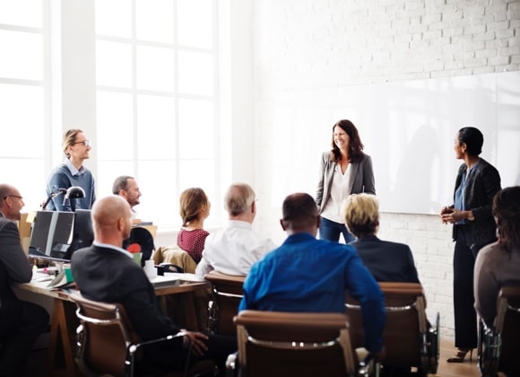 two women leading work seminar