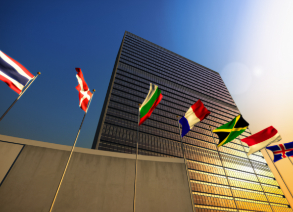 nations flags outside skyscraper