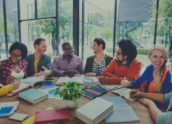 diverse people talking at round table